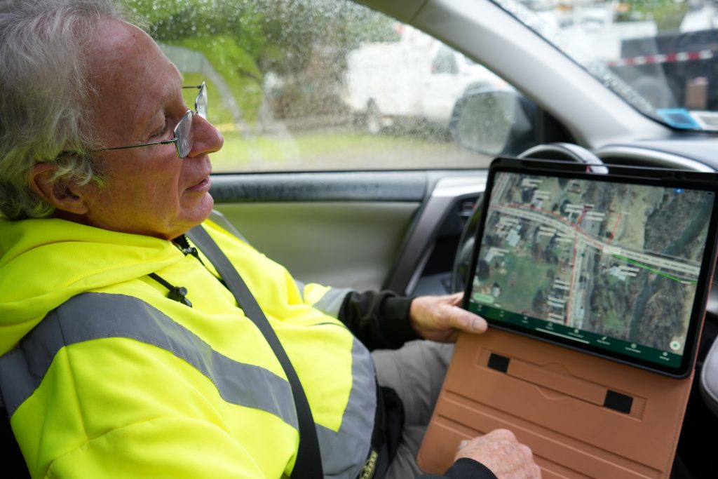 Local business man Lee HAefele mapping from iPad and driving around local communities